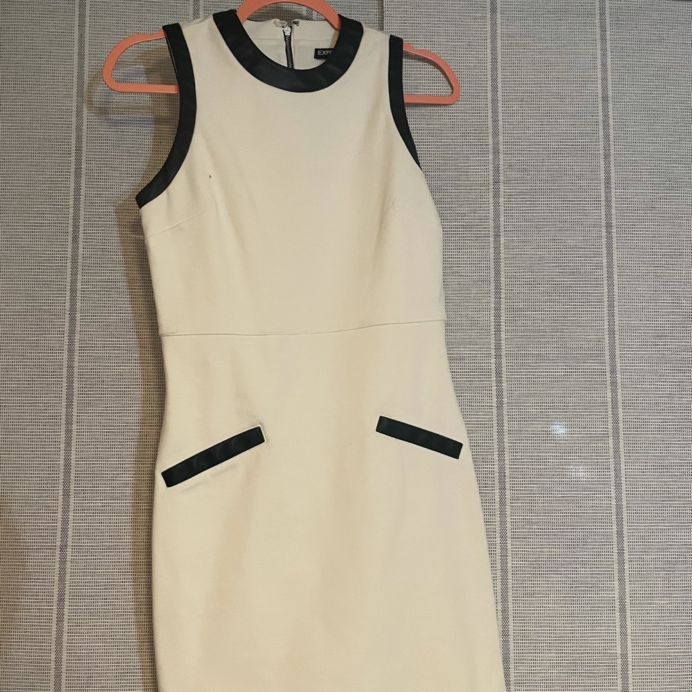 White express dress with leather piping.